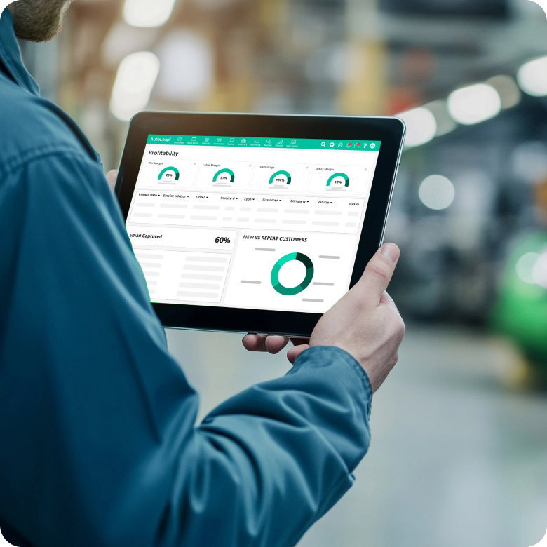 Shop manager reviewing the shop's profitability report on AutoLeap